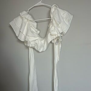 White ruffle crop top that ties in the back. Brand: idem dittto, in a size M.